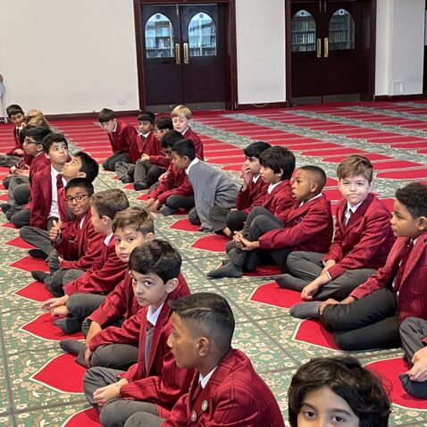 students sitting in a masjid