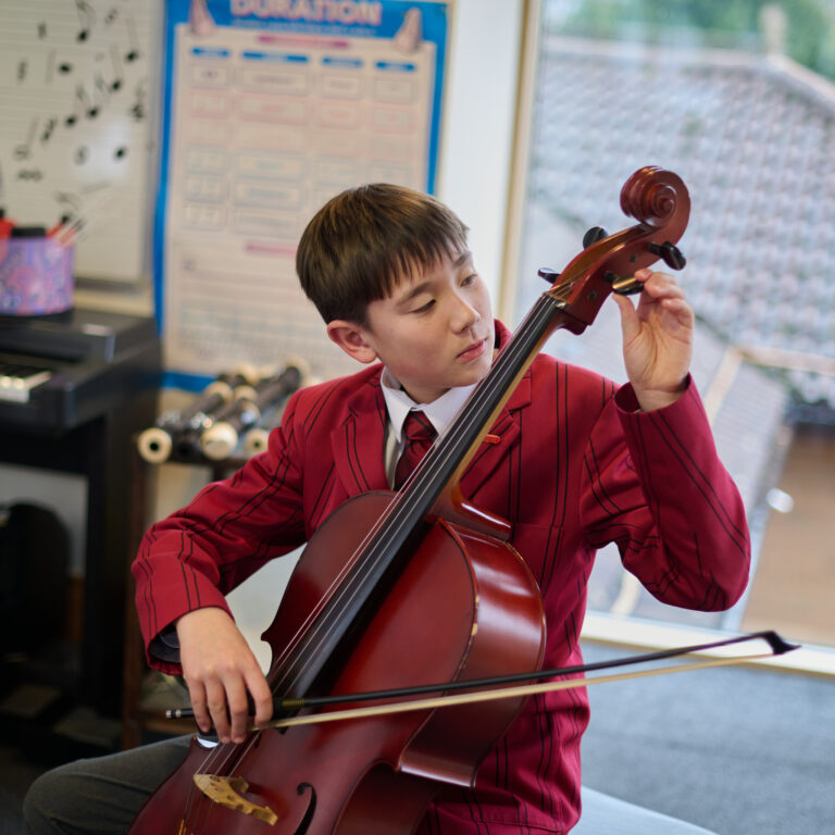 student using a cello