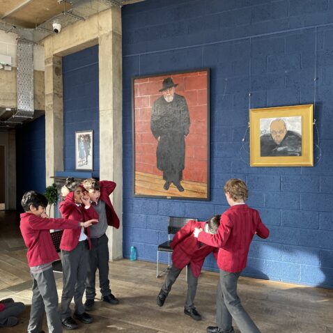 Group of five school children acting at the Rose Theatre